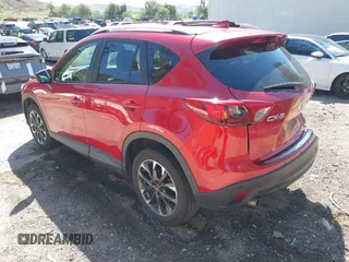 2016 Mazda CX-5 Grand Touring with VIN JM3KE2DY3G0686588, listed as a IAAI auction lot 41697312 with 65,090 mi miles. Bid and sale history available at carsss.com. Image 3.