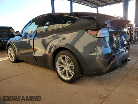 2021 Tesla Model Y Long Range with VIN 5YJYGDEEXMF151557, listed as a Copart auction lot 54936885 with 106,411 mi miles and Salvage Title. Bid and sale history available at DreamBid. Image 2.
