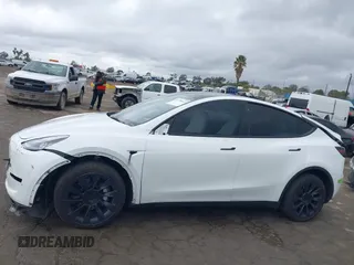 2023 Tesla Model Y Long Range with VIN 7SAYGDEE1PA106057, listed as a IAAI auction lot 41778642 with 1 mi miles. Bid and sale history available at carsss.com. Image 15.