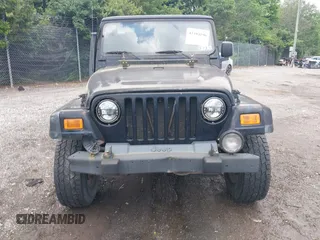 2004 Jeep Wrangler Sport z VIN 1J4FA49S94P792689, wystawiony jako IAAI lot #42394196 z przebiegiem Nie podano mil oraz . Historia ofert i sprzedaży dostępna na DreamBid. Obrazek 13.