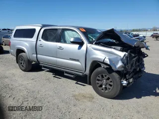 2021 Toyota Tacoma SR5 with VIN 3TMDZ5BN0MM103256, listed as a Copart auction lot 50101675 with 49,673 mi miles and Salvage title. Bid and sale history available at DreamBid. Image 4.