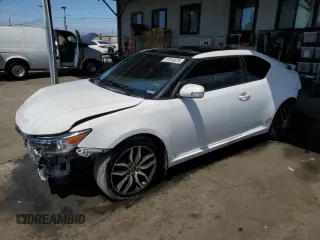 2014 Scion tC z VIN JTKJF5C75E3069628, wystawiony jako Copart lot #57916075 z przebiegiem 91 475 mil mil oraz Szkody całkowita. Historia ofert i sprzedaży dostępna na DreamBid. Obrazek 1.