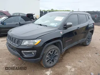 2019 Jeep Compass Trailhawk z VIN 3C4NJDDB5KT618149, wystawiony jako IAAI lot #41959320 z przebiegiem 99 795 mil mil oraz . Historia ofert i sprzedaży dostępna na DreamBid. Obrazek 2.