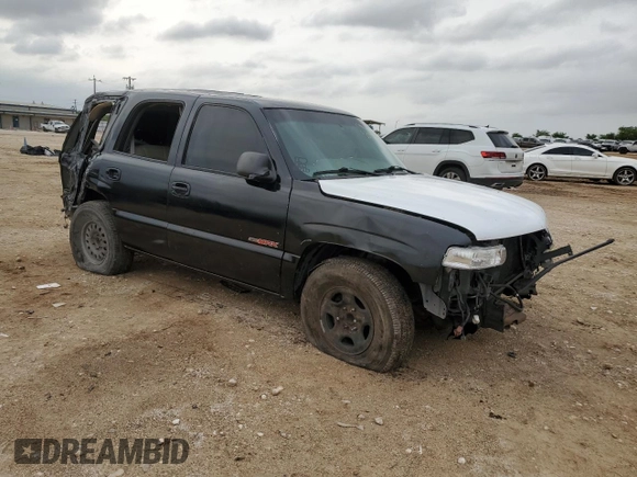 2002 Chevrolet Tahoe LS with VIN 1GNEC13Z52R230281, listed as a Copart auction lot 53447985 with 309,170 mi miles and Salvage title. Bid and sale history available at DreamBid. Image 4.