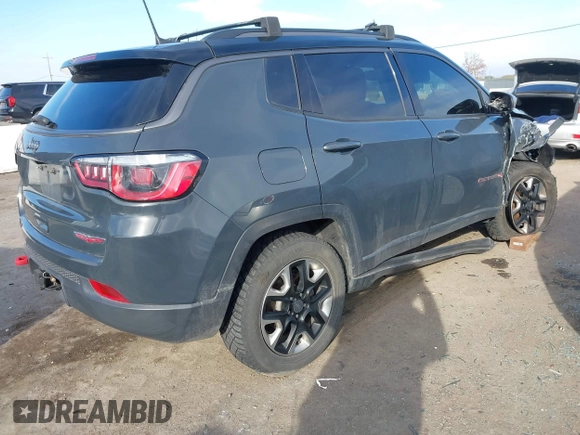 2017 Jeep Compass Trailhawk with VIN 3C4NJDDBXHT657425, listed as a IAAI auction lot 41022289 with 83,003 mi miles and . Bid and sale history available at DreamBid. Image 4.