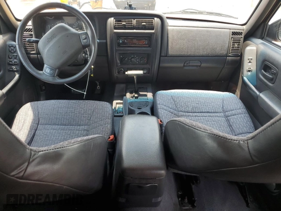 1999 Jeep Cherokee Sport with VIN 1J4FT68SXXL669549, listed as a Copart auction lot 62367015 with 194,446 mi miles and Salvage title. Bid and sale history available at DreamBid. Image 8.