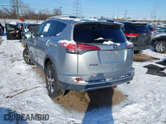 2018 Toyota RAV4 XLE with VIN 2T3RFREV8JW753853, listed as a IAAI auction lot 41526071 with 104,642 mi miles. Bid and sale history available at carsss.com. Image 3.