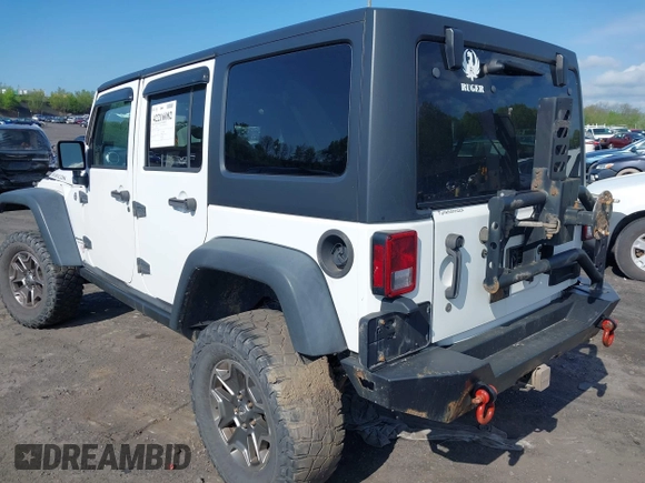 2014 Jeep Wrangler Unlimited Rubicon X with VIN 1C4BJWFG6EL240849, listed as a IAAI auction lot 42216082 with 118,912 mi miles and . Bid and sale history available at DreamBid. Image 3.