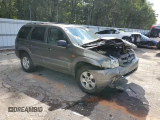 2002 Mazda Tribute LX with VIN 4F2YU09122KM55085, listed as a Copart auction lot 71604184 with 185,158 mi miles and Salvage Title. Bid and sale history available at carsss.com. Image 4.