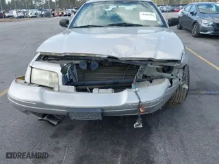 2004 Ford Crown Victoria Standard with VIN 2FAFP73W94X107561, listed as a IAAI auction lot 41804985 with 128,066 mi miles. Bid and sale history available at carsss.com. Image 6.