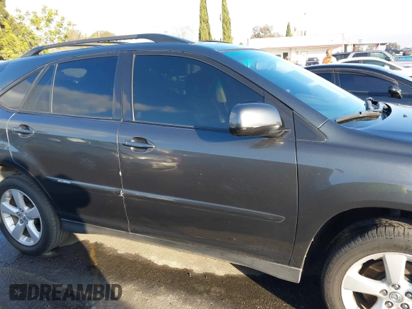 2007 Lexus RX 400h z VIN JTJGW31U772004557, wystawiony jako IAAI lot #41458659 z przebiegiem 193 678 mil mil oraz . Historia ofert i sprzedaży dostępna na DreamBid. Obrazek 13.
