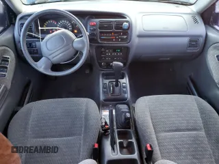 2001 Suzuki Vitara JX z VIN 2S3TD52V916109753, wystawiony jako Copart lot #41543965 z przebiegiem 102 720 mil mil oraz Szkody całkowita. Historia ofert i sprzedaży dostępna na DreamBid. Obrazek 8.