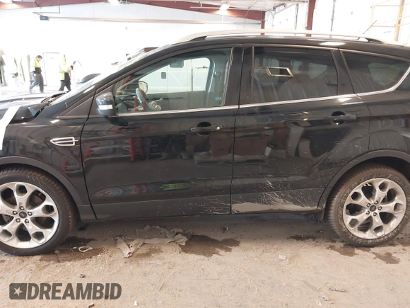2016 Ford Escape Titanium with VIN 1FMCU0JX3GUB70607, listed as a IAAI auction lot 41727421 with 106,857 mi miles. Bid and sale history available at carsss.com. Image 15.