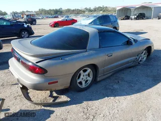 2000 Pontiac Firebird with VIN 2G2FS22K0Y2112410, listed as a IAAI auction lot 41676541 with 129,857 mi miles. Bid and sale history available at carsss.com. Image 4.