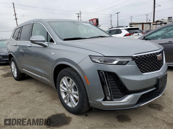 2023 Cadillac XT6 FWD Luxury z VIN 1GYKPAR47PZ147139, wystawiony jako Copart lot #50783595 z przebiegiem 27 684 mil mil oraz Szkoda całkowita • Salvage title. Historia ofert i sprzedaży dostępna na DreamBid. Obrazek 4.