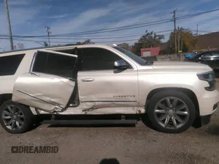 2015 Chevrolet Suburban LTZ with VIN 1GNSKKKC0FR551031, listed as a IAAI auction lot 40694559 with 184,261 mi miles. Bid and sale history available at carsss.com. Image 13.