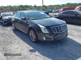 2014 Cadillac XTS Premium with VIN 2G61P5S38E9226047, listed as a IAAI auction lot 41906192 with 90,890 mi miles. Bid and sale history available at carsss.com. Image 1.