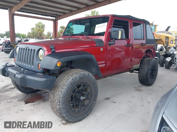 2012 Jeep Wrangler Unlimited Sport z VIN 1C4BJWDG3CL207291, wystawiony jako IAAI lot #42211454 z przebiegiem 110 864 mil mil oraz . Historia ofert i sprzedaży dostępna na DreamBid. Obrazek 2.