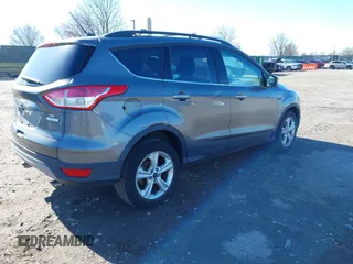 2014 Ford Escape SE with VIN 1FMCU0GXXEUB37821, listed as a IAAI auction lot 41853052 with 197,773 mi miles. Bid and sale history available at carsss.com. Image 4.