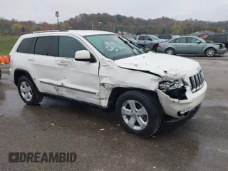 2012 Jeep Grand Cherokee Laredo with VIN 1C4RJFAG6CC297958, listed as a IAAI auction lot 40859811 with 213,499 mi miles. Bid and sale history available at carsss.com. Image 1.