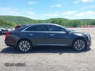 2013 Cadillac XTS Luxury z VIN 2G61R5S33D9101434, wystawiony jako IAAI lot #42290199 z przebiegiem 48 075 mil mil oraz . Historia ofert i sprzedaży dostępna na DreamBid. Obrazek 13.