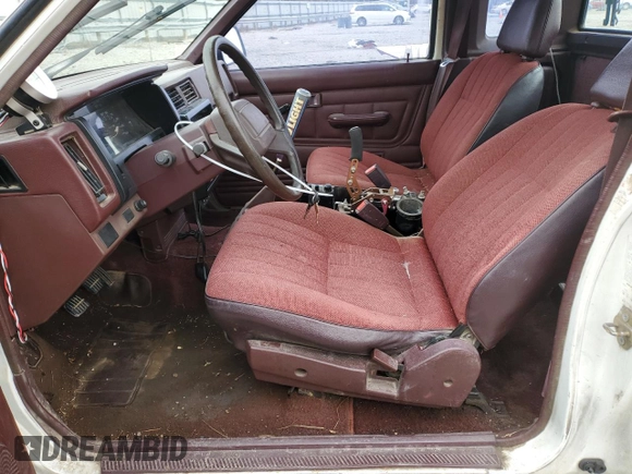 1990 Nissan Frontier with VIN 1N6SD16S9LC404281, listed as a Copart auction lot 84214904 with 279,270 mi miles and Salvage title. Bid and sale history available at DreamBid. Image 7.