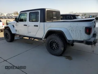2021 Jeep Gladiator Willys with VIN 1C6HJTAGXML623599, listed as a Copart auction lot 48971735 with 35,052 mi miles and Salvage Title. Bid and sale history available at carsss.com. Image 2.