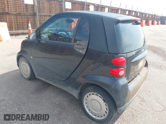 2009 Smart fortwo Pure z VIN WMEEJ31X59K312270, wystawiony jako IAAI lot #41910686 z przebiegiem 111 107 mil mil oraz . Historia ofert i sprzedaży dostępna na DreamBid. Obrazek 3.