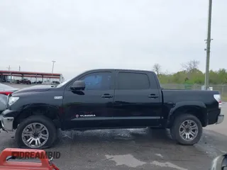 2011 Toyota Tundra 4WD Truck with VIN 5TFDW5F10BX166901, listed as a IAAI auction lot 41876554 with 207,187 mi miles. Bid and sale history available at carsss.com. Image 14.