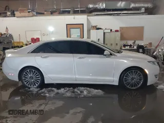 2014 Lincoln MKZ with VIN 3LN6L2J92ER836146, listed as a IAAI auction lot 41583343 with 130,613 mi miles. Bid and sale history available at carsss.com. Image 14.