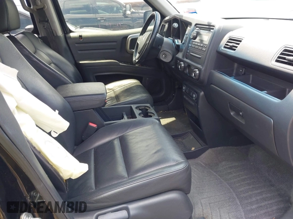 2011 Honda Ridgeline RTL with VIN 5FPYK1F54BB011472, listed as a IAAI auction lot 42112512 with 194,974 mi miles and . Bid and sale history available at DreamBid. Image 5.