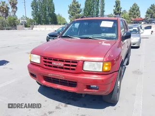 1999 Isuzu Rodeo S z VIN 4S2CK58WXX4346156, wystawiony jako IAAI lot #42328951 z przebiegiem 196 182 mil mil oraz . Historia ofert i sprzedaży dostępna na DreamBid. Obrazek 6.
