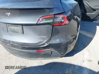 2022 Tesla Model Y Performance with VIN 7SAYGDEF6NF540094, listed as a IAAI auction lot 41786865 with 28,356 mi miles and . Bid and sale history available at DreamBid. Image 6.