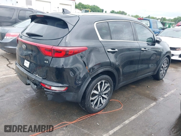 2017 Kia Sportage EX with VIN KNDPN3AC3H7285581, listed as a IAAI auction lot 42366792 with 90,959 mi miles and . Bid and sale history available at DreamBid. Image 4.