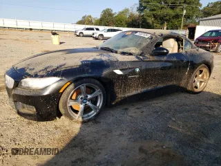 2011 BMW Z4 sDrive35i with VIN WBALM7C5XBE383093, listed as a Copart auction lot 74487034 with 0 mi miles and Salvage Title. Bid and sale history available at carsss.com. Image 1.
