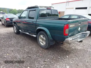 2000 Nissan Frontier XE with VIN 1N6ED27T5YC429406, listed as a IAAI auction lot 42150671 with 303,869 mi miles and . Bid and sale history available at DreamBid. Image 3.