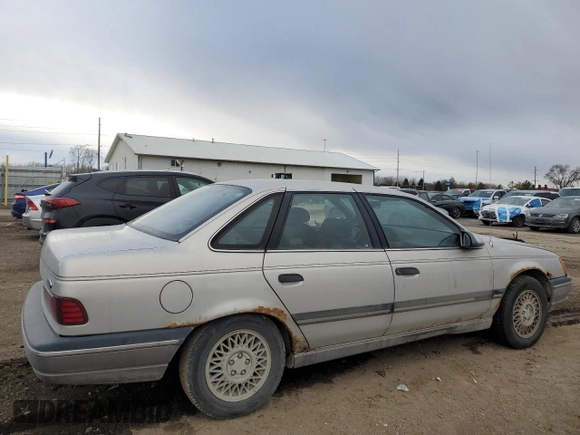 1991 Ford Taurus with VIN 1FACP52U9MG101093, listed as a Copart auction lot 45948105 with 594,696 mi miles and Salvage title. Bid and sale history available at DreamBid. Image 3.