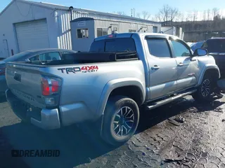 2023 Toyota Tacoma 4WD SR with VIN 3TMCZ5ANXPM543065, listed as a IAAI auction lot 41101092 with 33,792 mi miles. Bid and sale history available at carsss.com. Image 4.