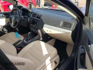 2013 Volkswagen Jetta Hybrid SEL with VIN 3VW637AJ2DM303167, listed as a IAAI auction lot 41353536 with 64,964 mi miles and . Bid and sale history available at DreamBid. Image 5.