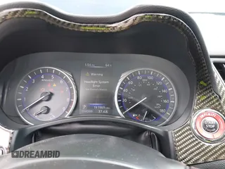 2014 Infiniti Q50 Premium z VIN JN1BV7AP3EM690571, wystawiony jako IAAI lot #42136354 z przebiegiem 191 969 mil mil oraz . Historia ofert i sprzedaży dostępna na DreamBid. Obrazek 7.