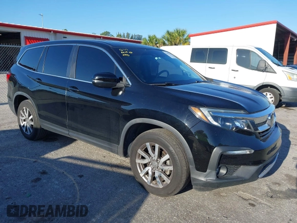 2021 Honda Pilot EX-L with VIN 5FNYF5H55MB044677, listed as a IAAI auction lot 42038704 with 38,684 mi miles and . Bid and sale history available at carsss.com. Image 1.