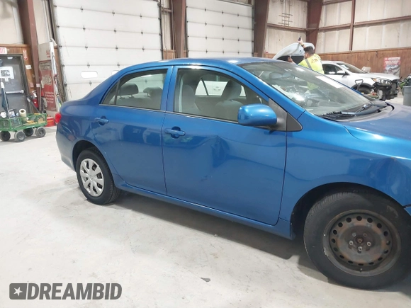 2009 Toyota Corolla with VIN JTDBL40E699037792, listed as a IAAI auction lot 41838231 with 199,690 mi miles. Bid and sale history available at carsss.com. Image 6.