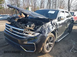 2021 Volkswagen Atlas SE z VIN 1V2RE2CA8MC201494, wystawiony jako IAAI lot #41498075 z przebiegiem 67 687 mil mil oraz . Historia ofert i sprzedaży dostępna na DreamBid. Obrazek 2.