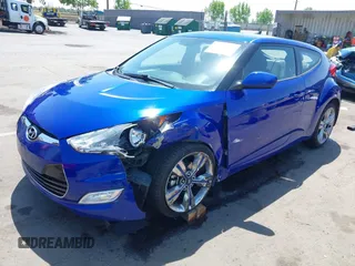 2013 Hyundai Veloster w/Black Int with VIN KMHTC6AD6DU143974, listed as a IAAI auction lot 42164745 with 136,195 mi miles and . Bid and sale history available at DreamBid. Image 2.