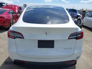 2020 Tesla Model Y Long Range with VIN 5YJYGDEE2LF058515, listed as a IAAI auction lot 41932748 with 62,885 mi miles and . Bid and sale history available at DreamBid. Image 16.