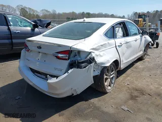 2019 Ford Fusion Hybrid Titanium with VIN 3FA6P0RU9KR126815, listed as a IAAI auction lot 41908472 with 146,059 mi miles. Bid and sale history available at carsss.com. Image 4.