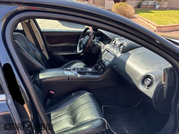 2012 Jaguar XJ with VIN SAJWA2GBXCLV24464, listed as a Copart auction lot 52572955 with 135,087 mi miles and Clean Title. Bid and sale history available at carsss.com. Image 5.