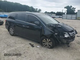 2014 Honda Odyssey EX-L with VIN 5FNRL5H68EB098207, listed as a Copart auction lot 66700024 with 161,701 mi miles and Salvage Title. Bid and sale history available at DreamBid. Image 4.