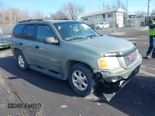 2004 GMC Envoy SLE with VIN 1GKDT13S942254932, listed as a IAAI auction lot 41509407 with 213,068 mi miles. Bid and sale history available at carsss.com. Image 1.
