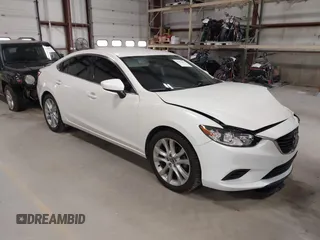 2014 Mazda 6 i Touring with VIN JM1GJ1V68E1139129, listed as a IAAI auction lot 41994657 with 121,668 mi miles and . Bid and sale history available at DreamBid. Image 1.